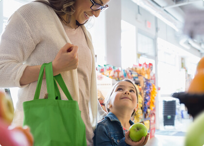 Mother and daughter in a grocery store.