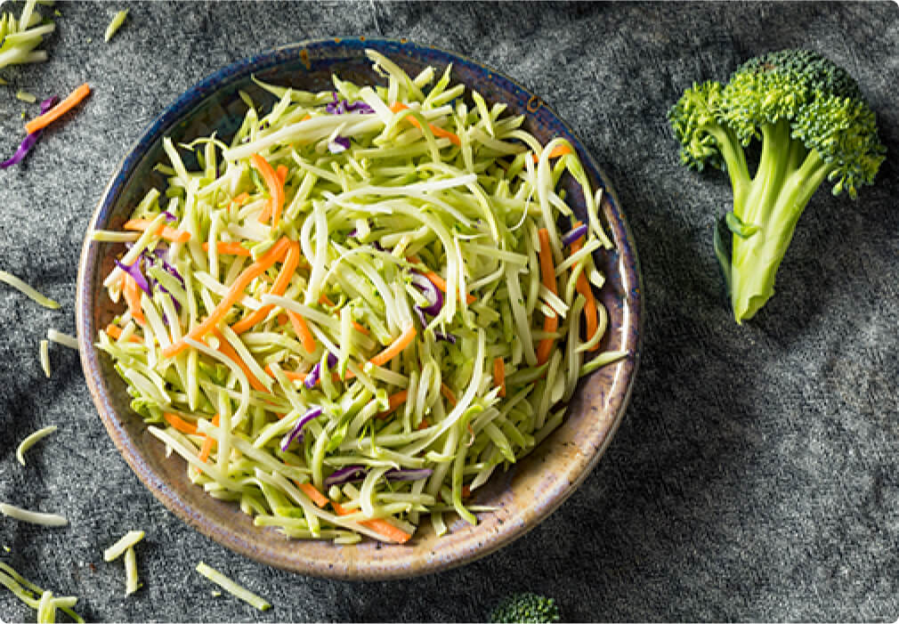 Bowl of freshly cut broccoli slaw